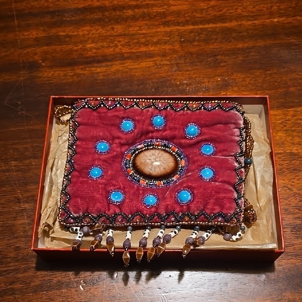 Vibrant Red and Blue Crossbody Bag with Intricate Design
